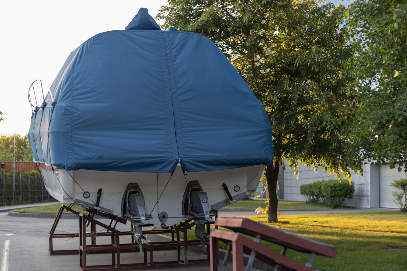 Boat with blue marine canvas cover and vertical zipper on a trailer