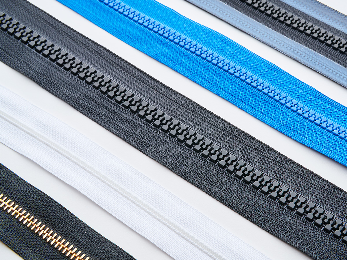 Assortment of Lenzip zipper chain in molded plastic and metal finishes